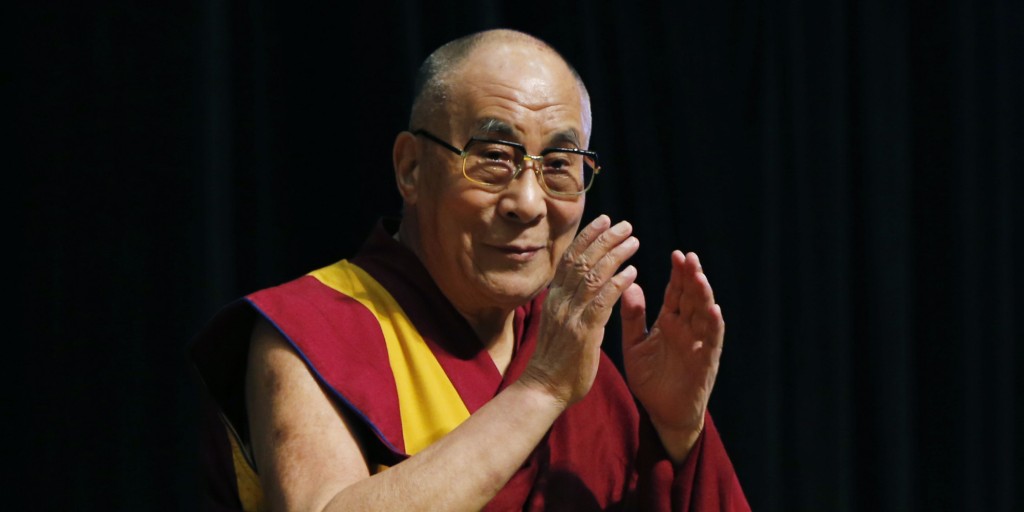 Tibetan spiritual leader the Dalai Lama greets an audience before his religious speech in Tokyo, Monday, Nov. 25, 2013. The Dalai Lama is in Japan for a 12-day visit to deliver speeches.(AP Photo/Koji Sasahara)